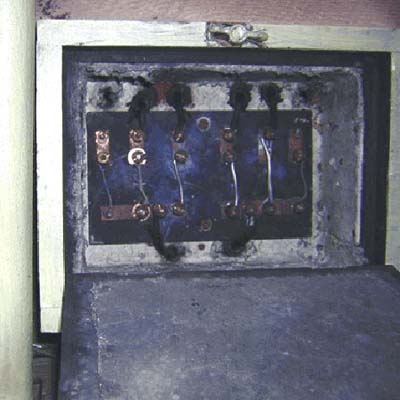 Old electrical sub-panel still active in 117-year-old house basement.