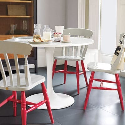 White chairs with bright red legs