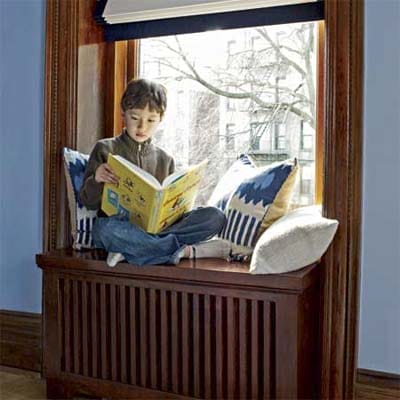 A child reading on a window seat