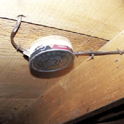 Tobacco chew can repurposed as makeshift electrical junction box.