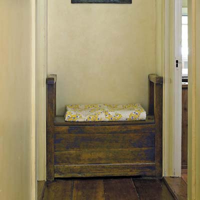 A storage bench with a cushion