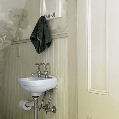 A powder room with a sink