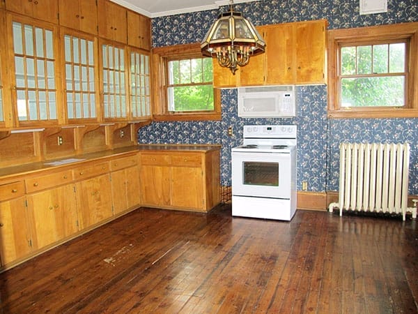 A kitchen with wooden cabinets