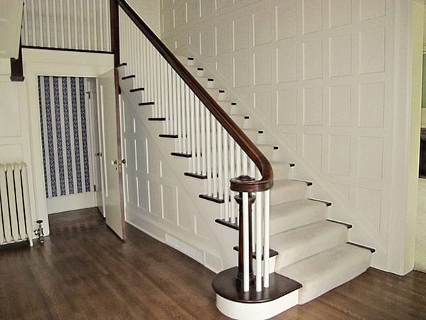 A staircase with a runner
