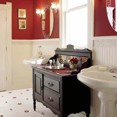 Classic bathroom with red accent wall and matching red details.