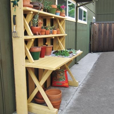 A potting bench made of a picnic table