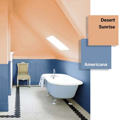 Bathroom with pale orange walls and dusky blue wainscot.