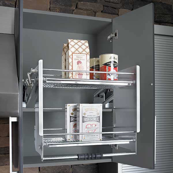 a shelf within a kitchen cabinet that can be pulled out and lowered