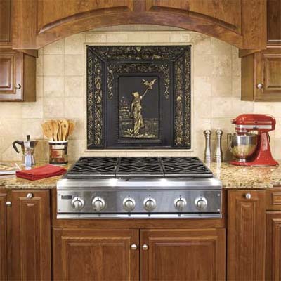 A stove in a kitchen with backsplash