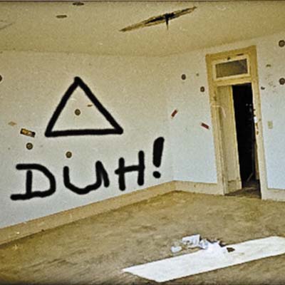A room with graffiti on the walls