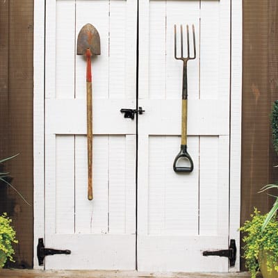 Two garden tools used as outdoor door pulls