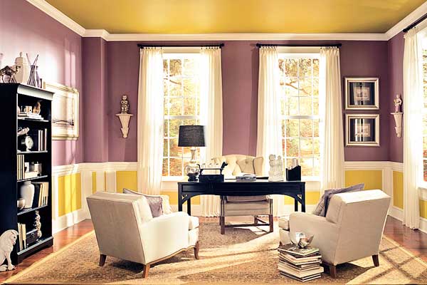 A living room with a yellow ceiling