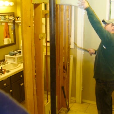 A man working in a bathroom