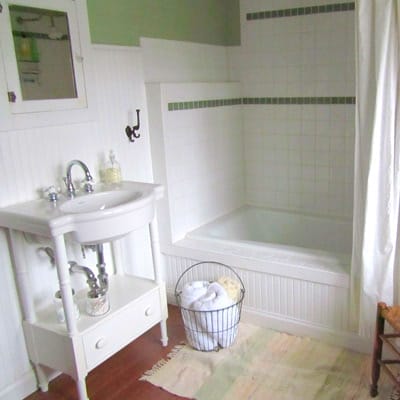 A white tiled bathroom