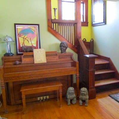 A piano next to staircase