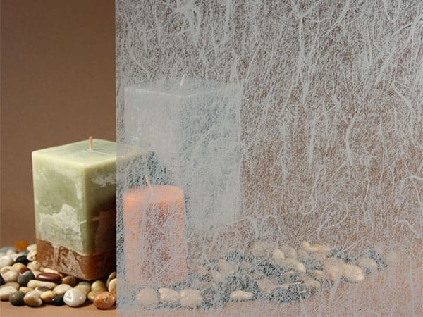Window film that mimics rice paper in front of candles.