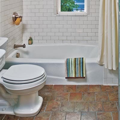 View of the bathtub and toilet.