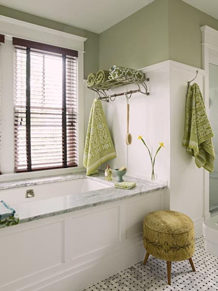 A bathroom with green accents