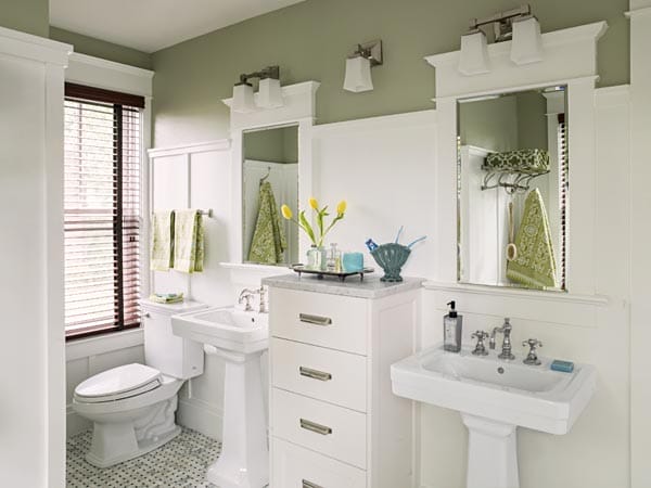 Double sinks and mirrors and a toilet in the master bathroom