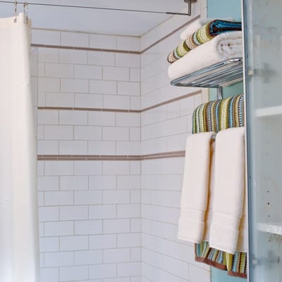 Close-up on shower tiling.