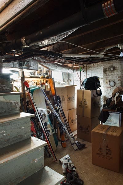 A basement full of boxes and gear.