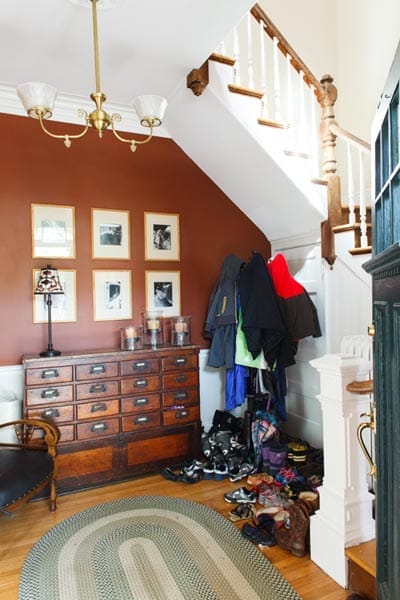 Foyer area with coats and shoes.