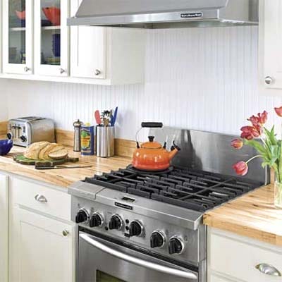 A stove and countertops in a kitchen