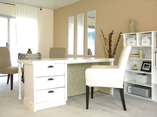 A white desk made from an old dresser in a home office.