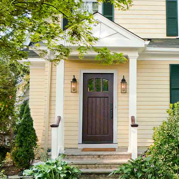 Entryway with dark wooden door.