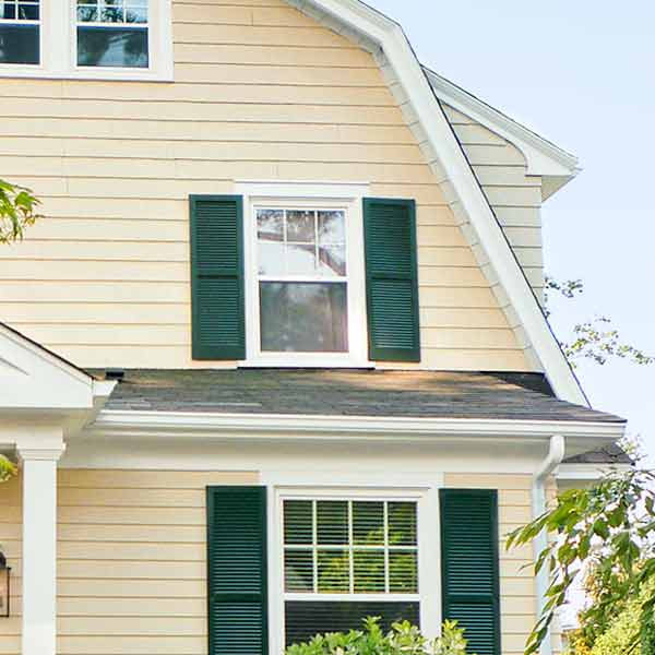 Windows with green shutters.