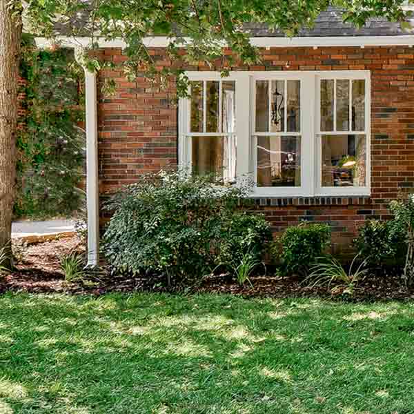 Transformed front lawn with new sod.