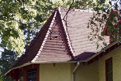 Interlocking ceramic tiles creating durable roofing.