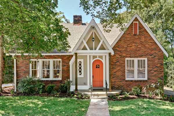 Brightened Tudor facade after restoration.