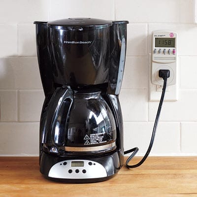 Coffee pot plugged into the wall.