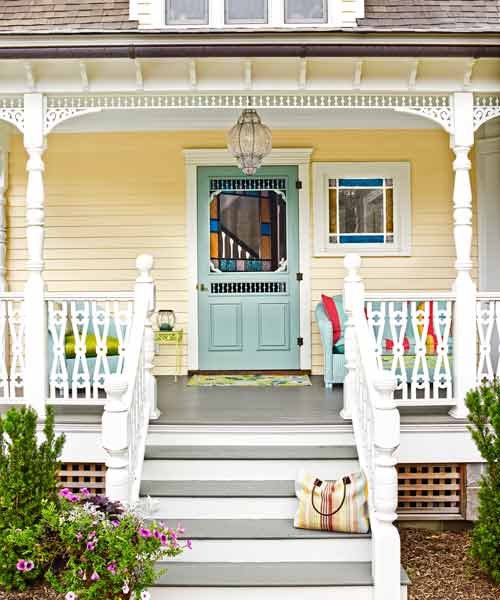 Victorian porch with reproduction gingerbread railing.