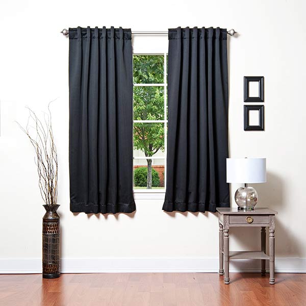 Blackout curtains and window treatments blocking light from a window.