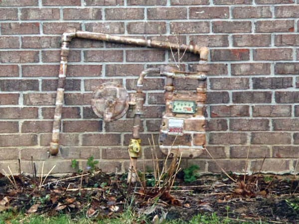 Gas meter camouflaged with paint to hide from utility company.