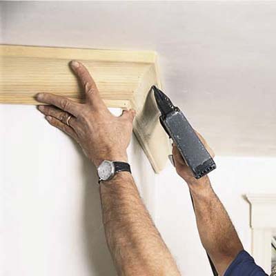 Man installing traditional crown molding