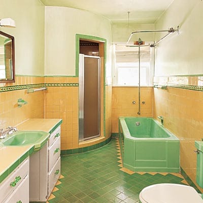 Outdated bathroom with bold candy-colored tile from original 1933 construction.
