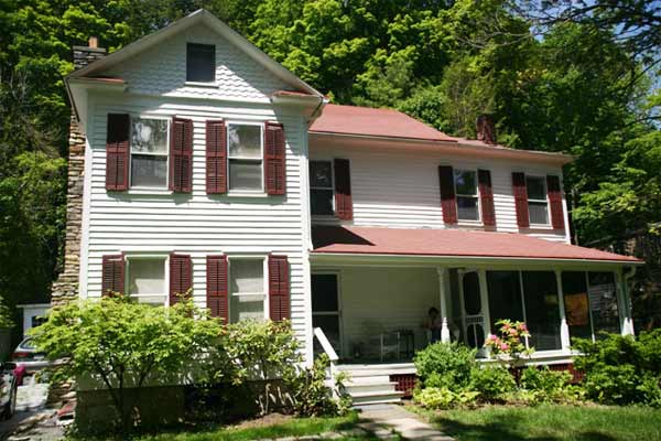 A two-story white house in Massachusetts