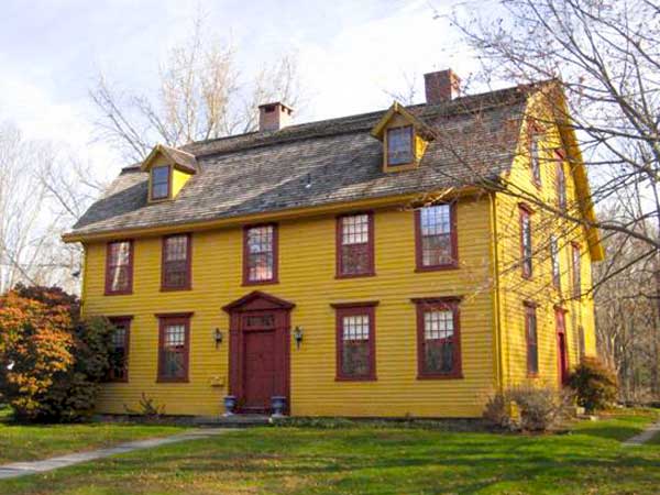 A two-story yellow house in Connecticut