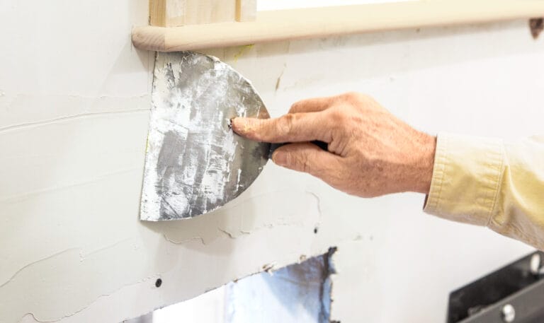Caulking and sealing dog door frame