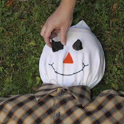 charcoal used as eyes on a scarecrow