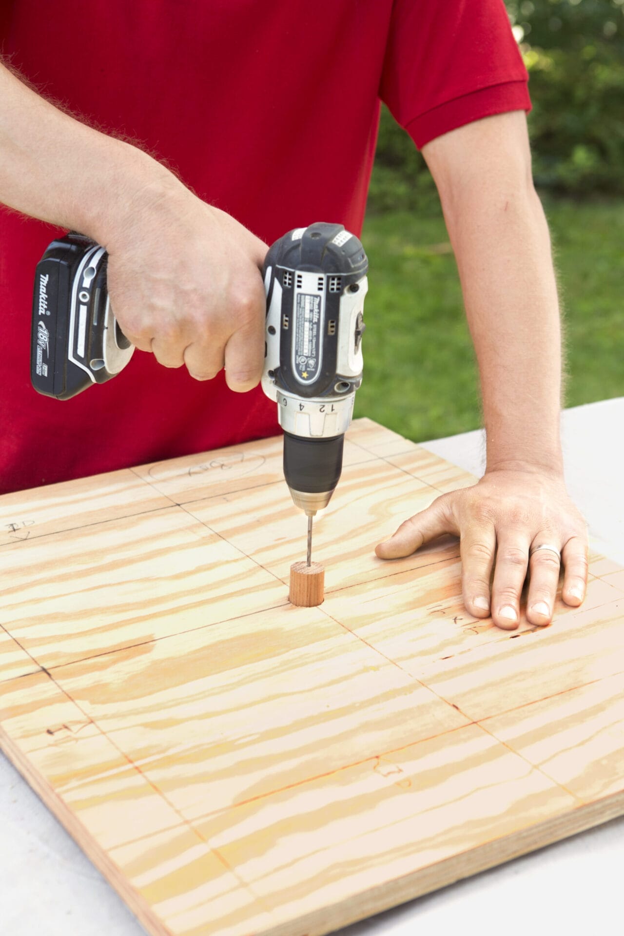 Step 6 for how to make a concrete planter, which involves installing the drain dowel
