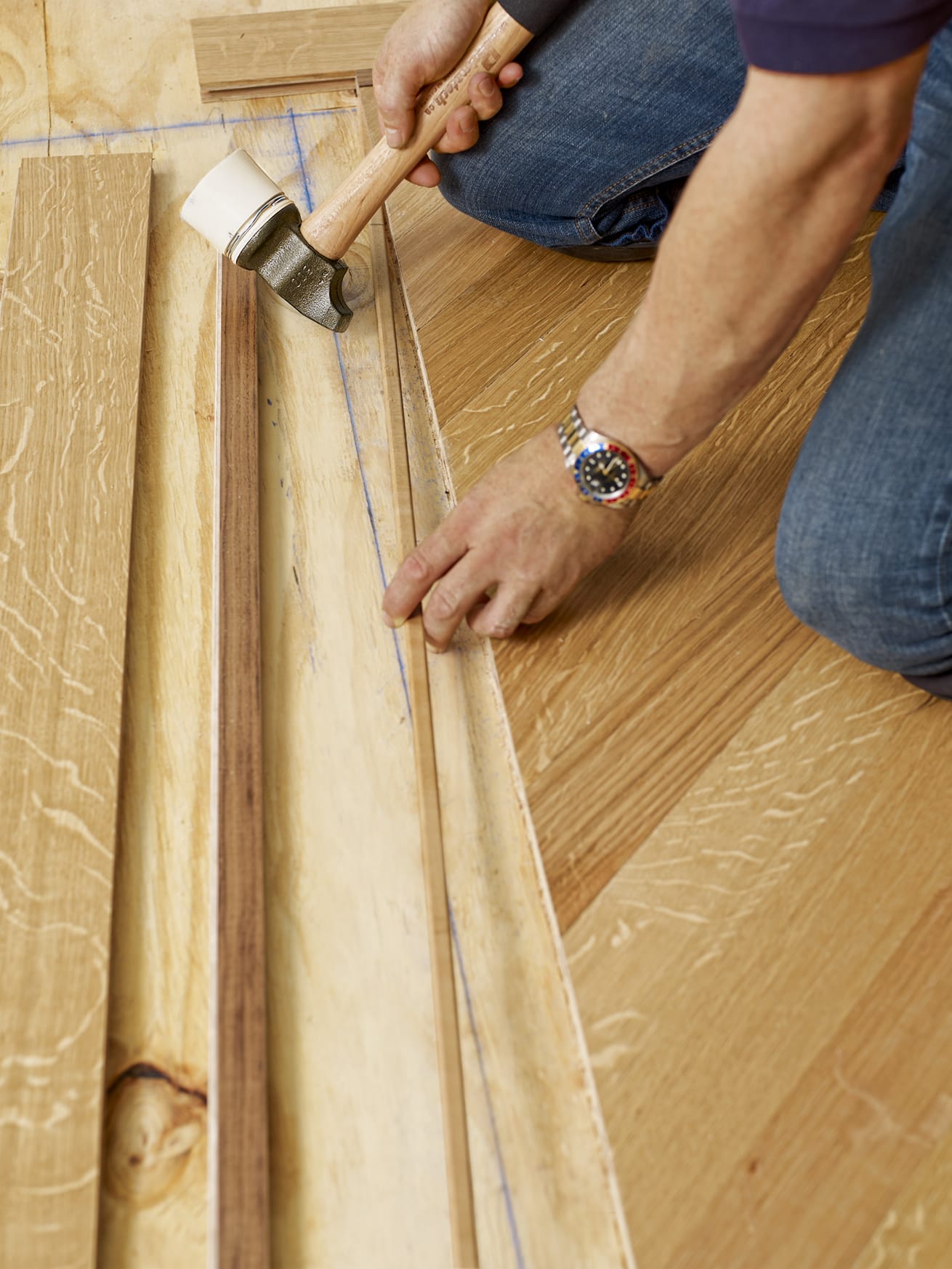 A strip feature is added to the herringbone flooring where the grove was just added.