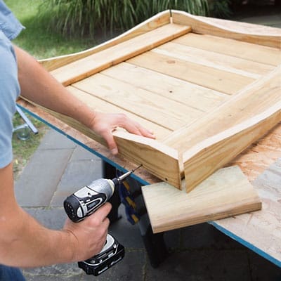 A arched skirtboards are attached to the lily pond base.