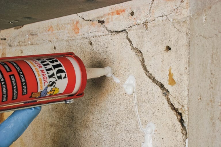 applying plaster patching to the wall