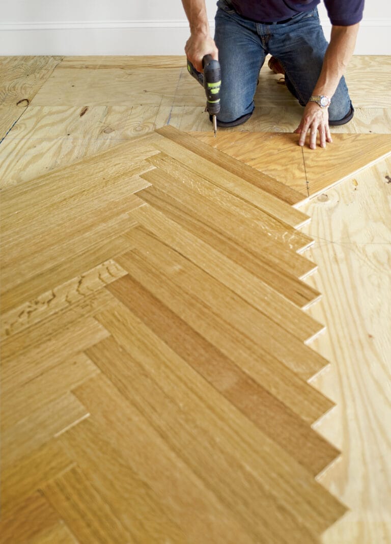 After finish that section of the herringbone floor pattern, a person moved the blank to work on the other side of the pattern.