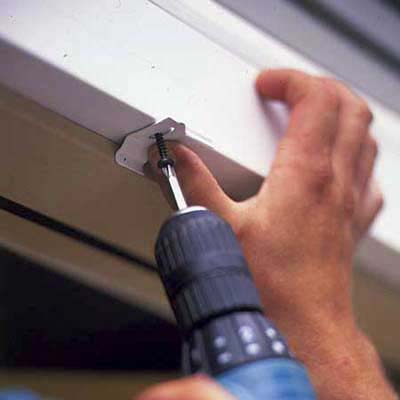 Side tracks are mounted to the door frame.