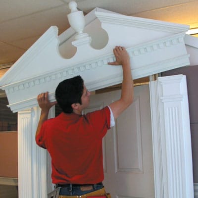 A man adds a pediment over the columns